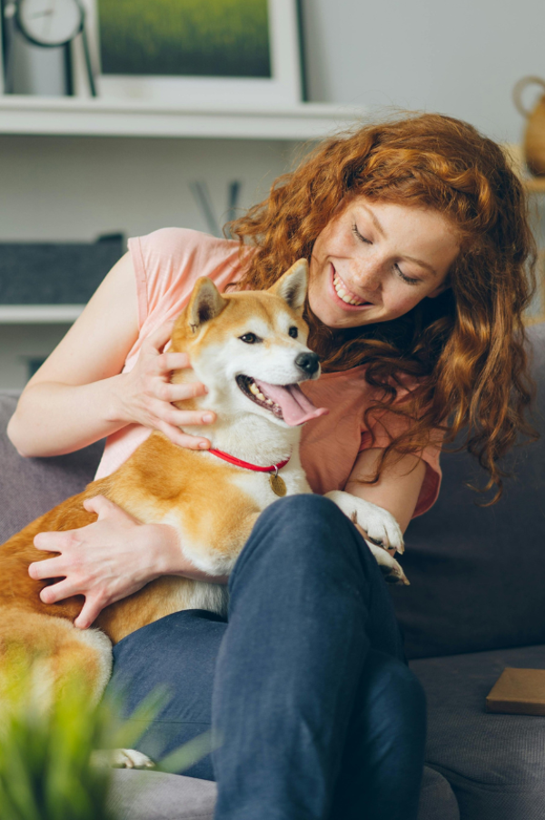 Woman with dog on the couch